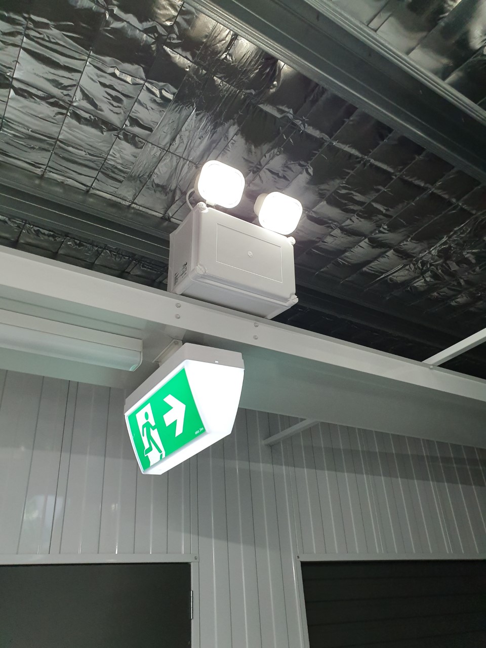 Recently installed exit sign and twin spot emergency light